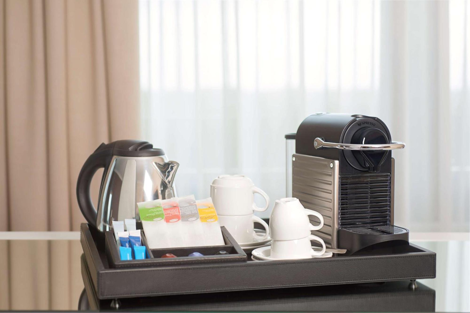 Отель Nh Collection Plaza Сантьяго Экстерьер фото A Nespresso coffee machine in a hotel room